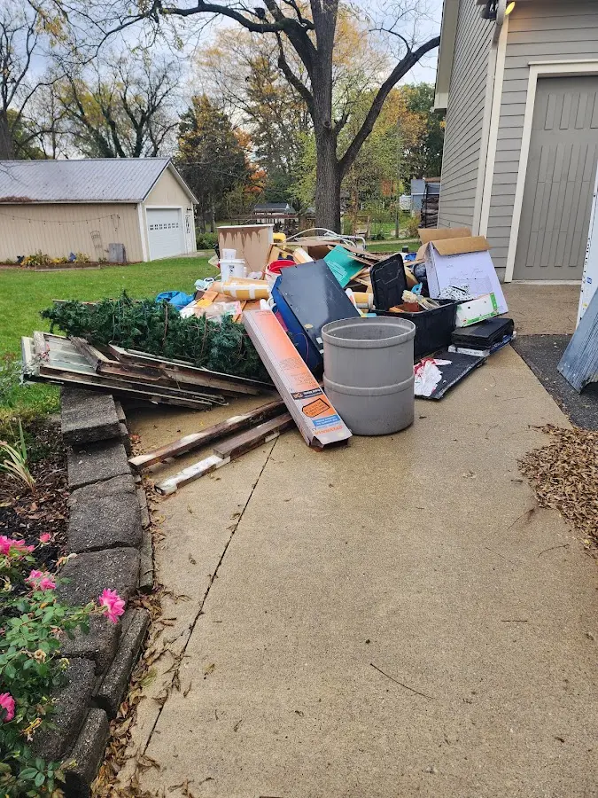 Dumpster being loaded with debris for Demolition Dumpster Rental in Neenah